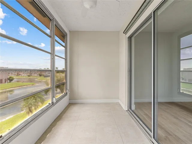 a view of a room with window and an ocean view