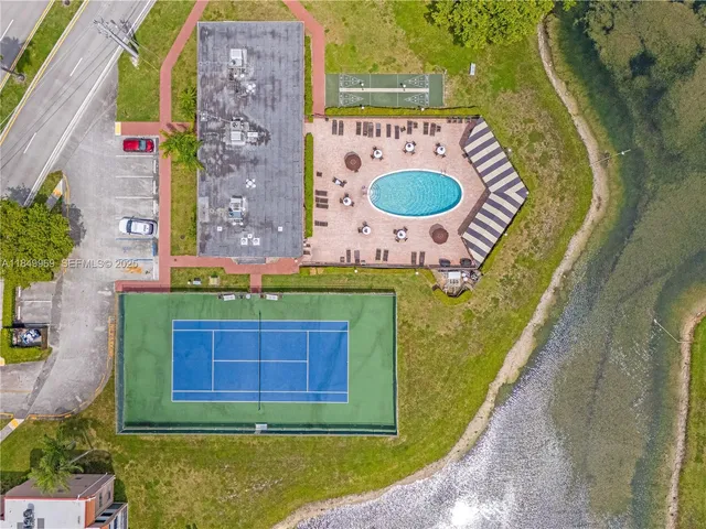 an aerial view of a chairs and table