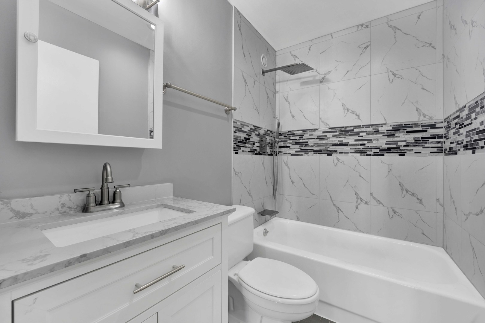 211 East Ohio Street, Unit 2925 Chicago, IL 60611 - Photo 8 of 14 a bathroom with a granite countertop sink toilet and shower