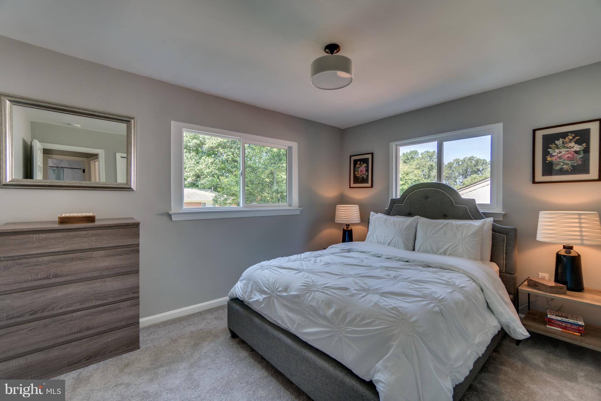 11517 Mapleview Drive Silver Spring, MD 20902 - Photo 12 of 18 a bedroom with a bed and a window