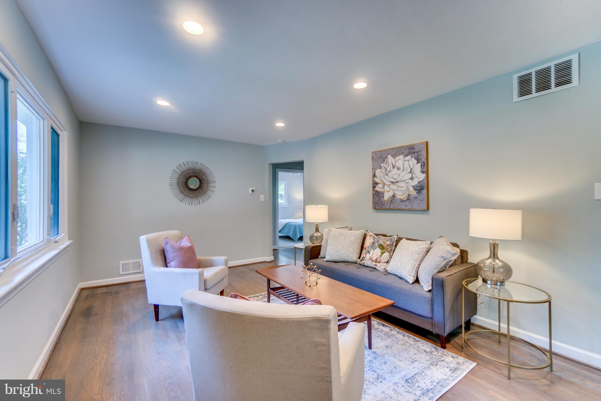 11517 Mapleview Drive Silver Spring, MD 20902 - Photo 3 of 18 a living room with furniture and a wooden floor