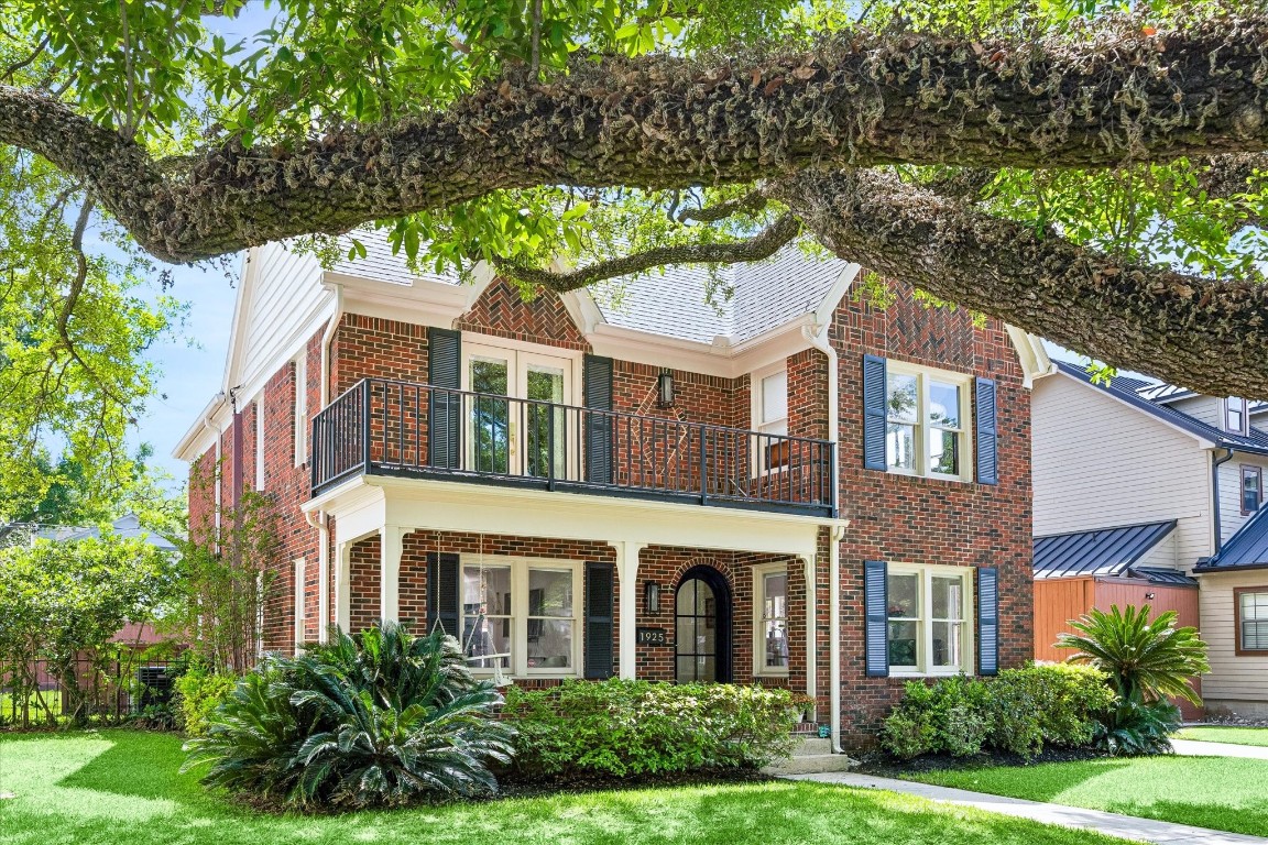 1925 Banks Street Houston, TX 77098 - Photo 2 of 38 This charming two-story brick home with a welcoming front porch and balcony, surrounded by lush greenery and mature trees.