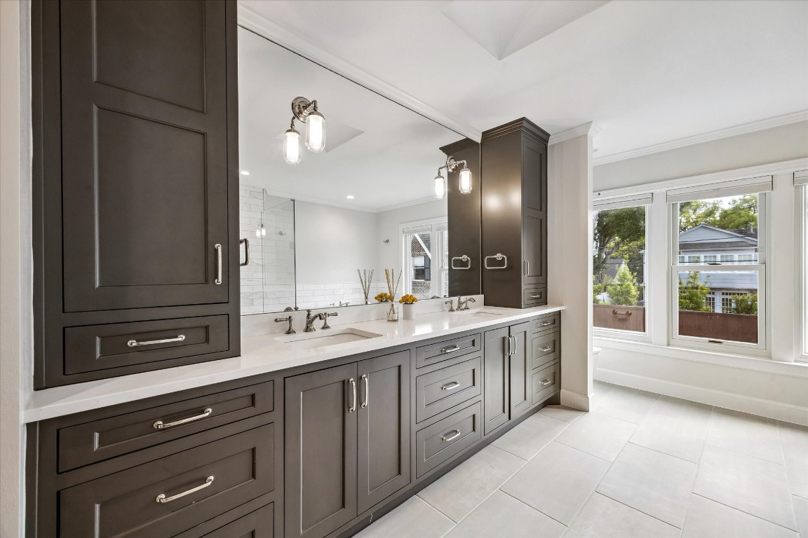 1925 Banks Street Houston, TX 77098 - Photo 22 of 38 An elegant design with dark cabinetry, dual sinks and modern fixtures.