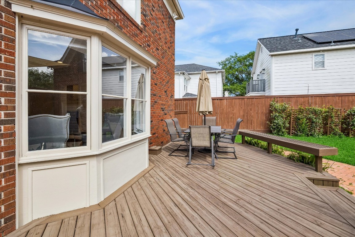 1925 Banks Street Houston, TX 77098 - Photo 35 of 38 A spacious wooden deck right outside the back door of the living room and breakfast nook. Great for entertaining!