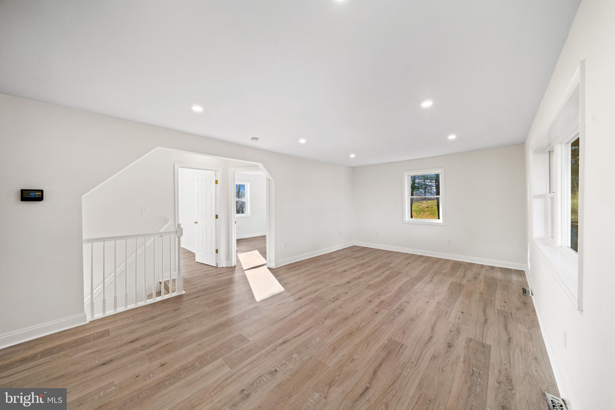 5209 Woodville Road Mount Airy, MD 21771 - Photo 18 of 90 a view of empty room with wooden floor