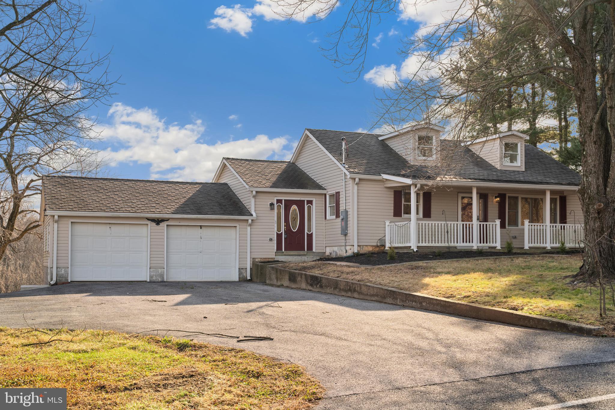 5209 Woodville Road Mount Airy, MD 21771 - Photo 2 of 90 a view of a house with a swimming pool and sitting area