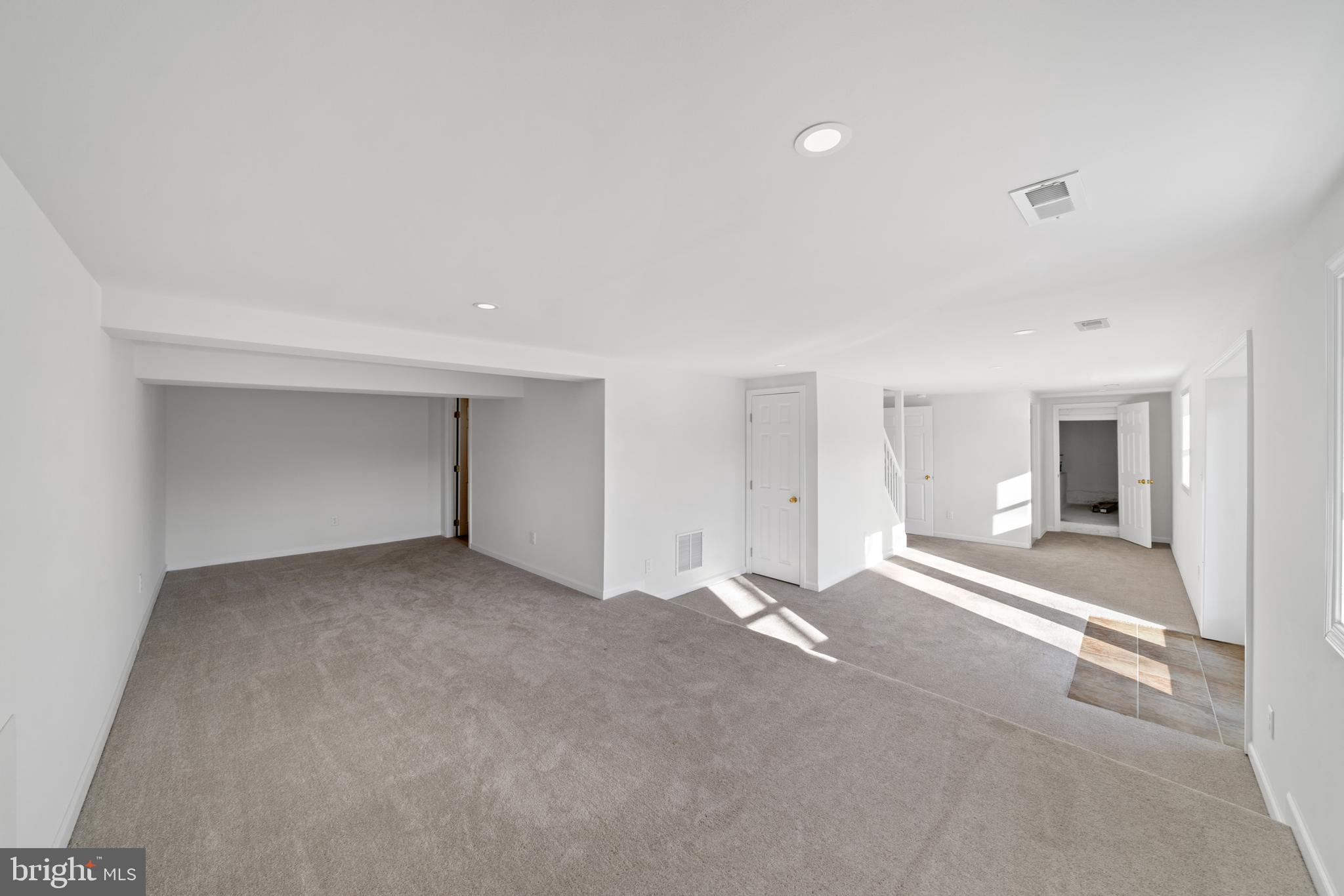 5209 Woodville Road Mount Airy, MD 21771 - Photo 30 of 90 a view of a big room with wooden floor and windows