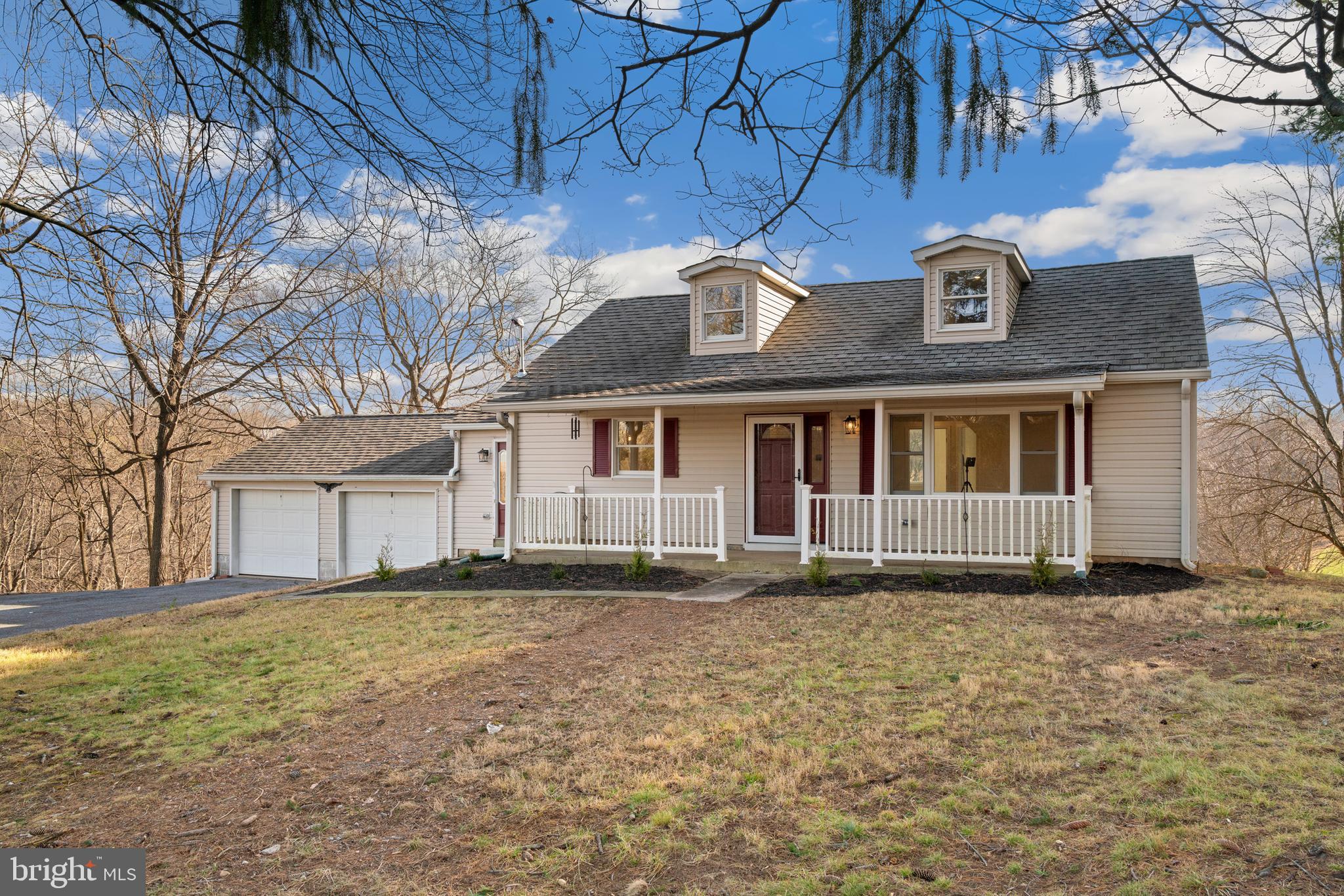 5209 Woodville Road Mount Airy, MD 21771 - Photo 3 of 90 a front view of a house with a yard