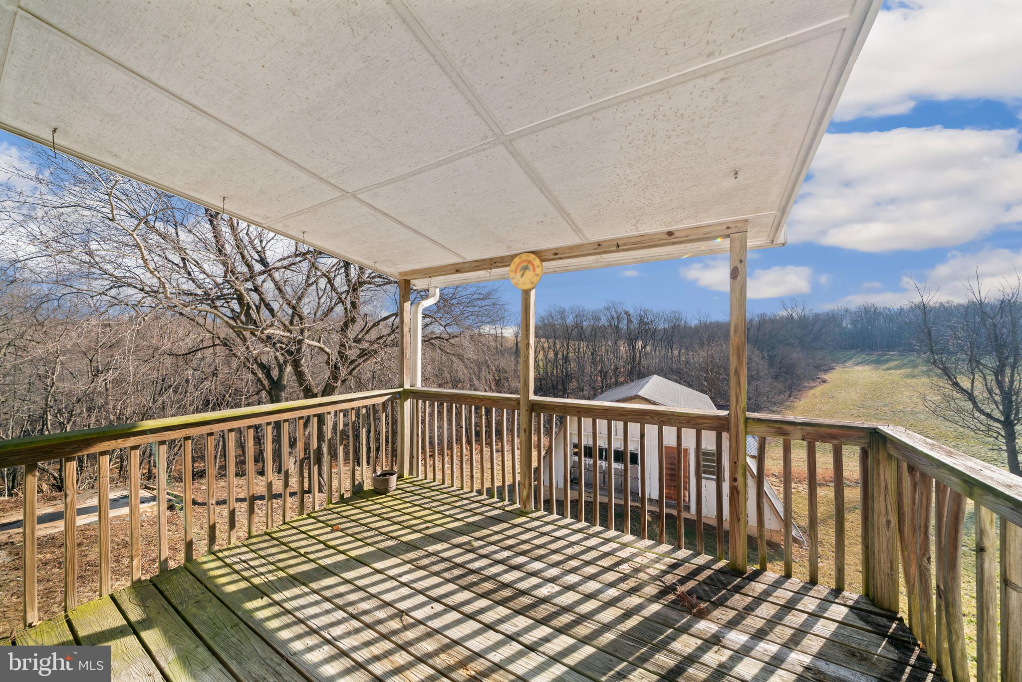 5209 Woodville Road Mount Airy, MD 21771 - Photo 40 of 90 a view of a balcony with wooden floor