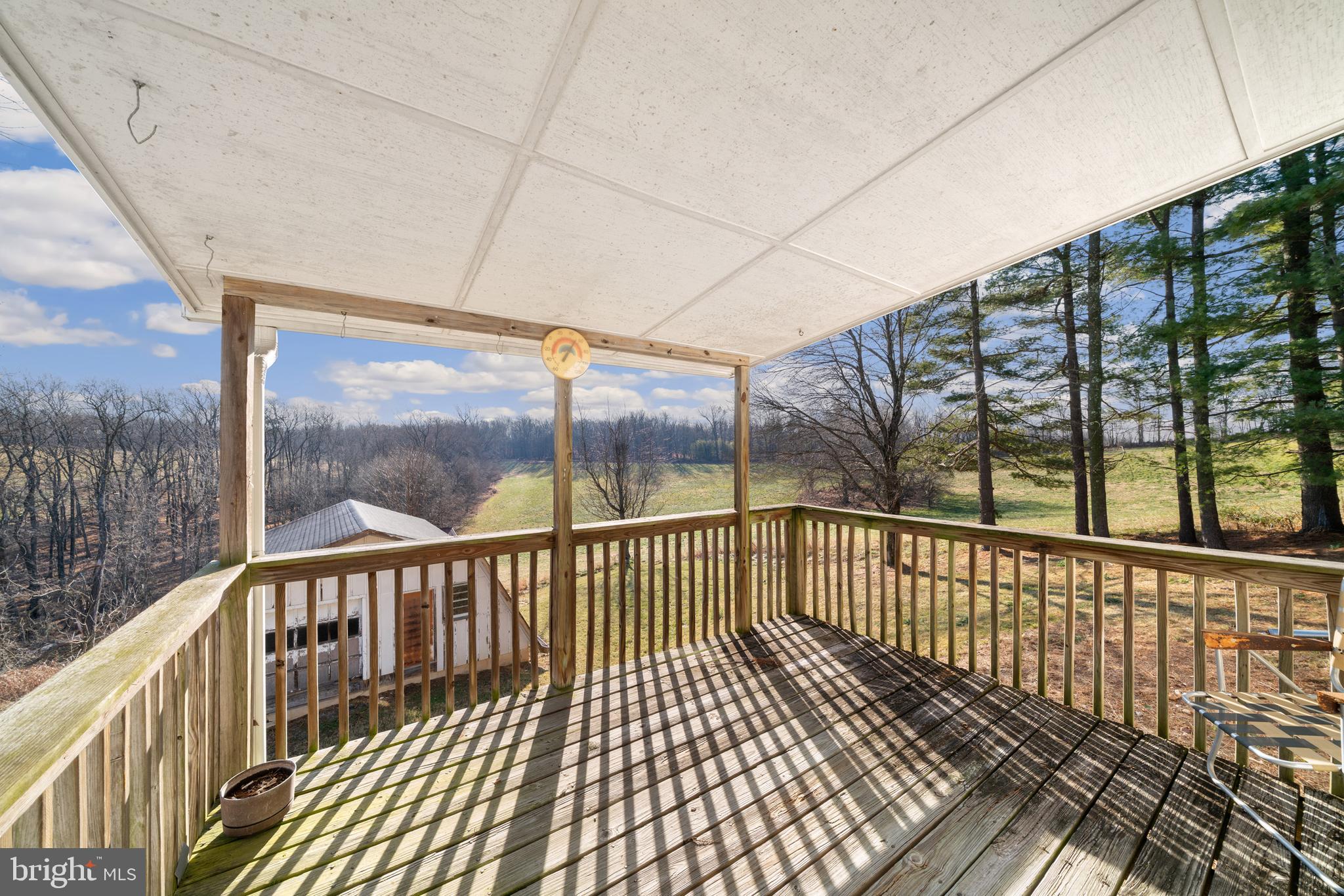 5209 Woodville Road Mount Airy, MD 21771 - Photo 41 of 90 a view of a balcony with wooden floor