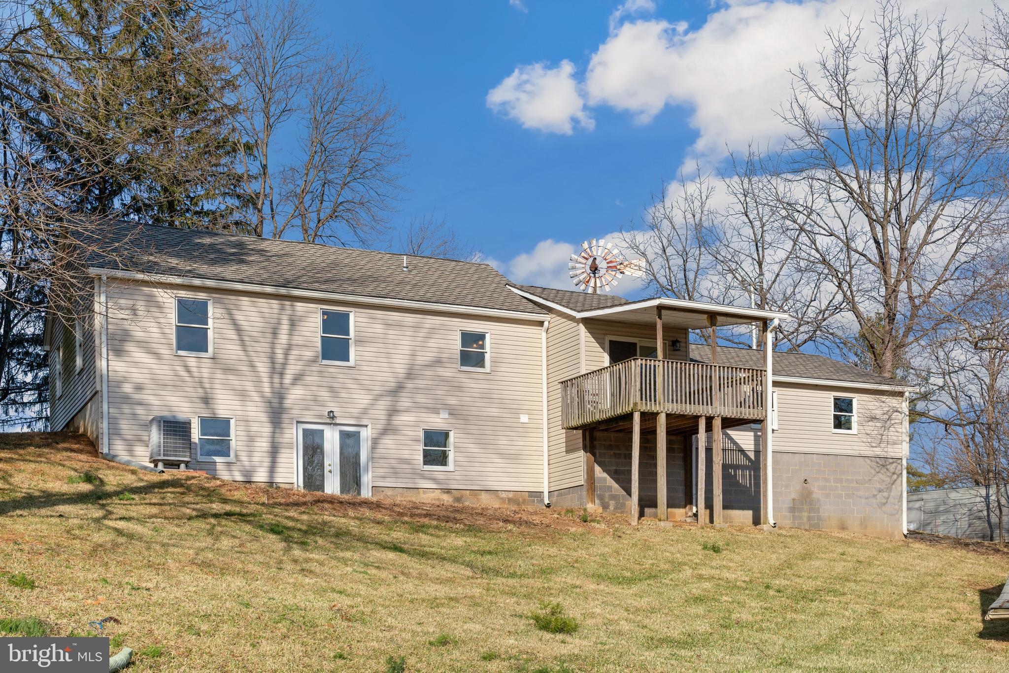 5209 Woodville Road Mount Airy, MD 21771 - Photo 42 of 90 a front view of a house with a yard