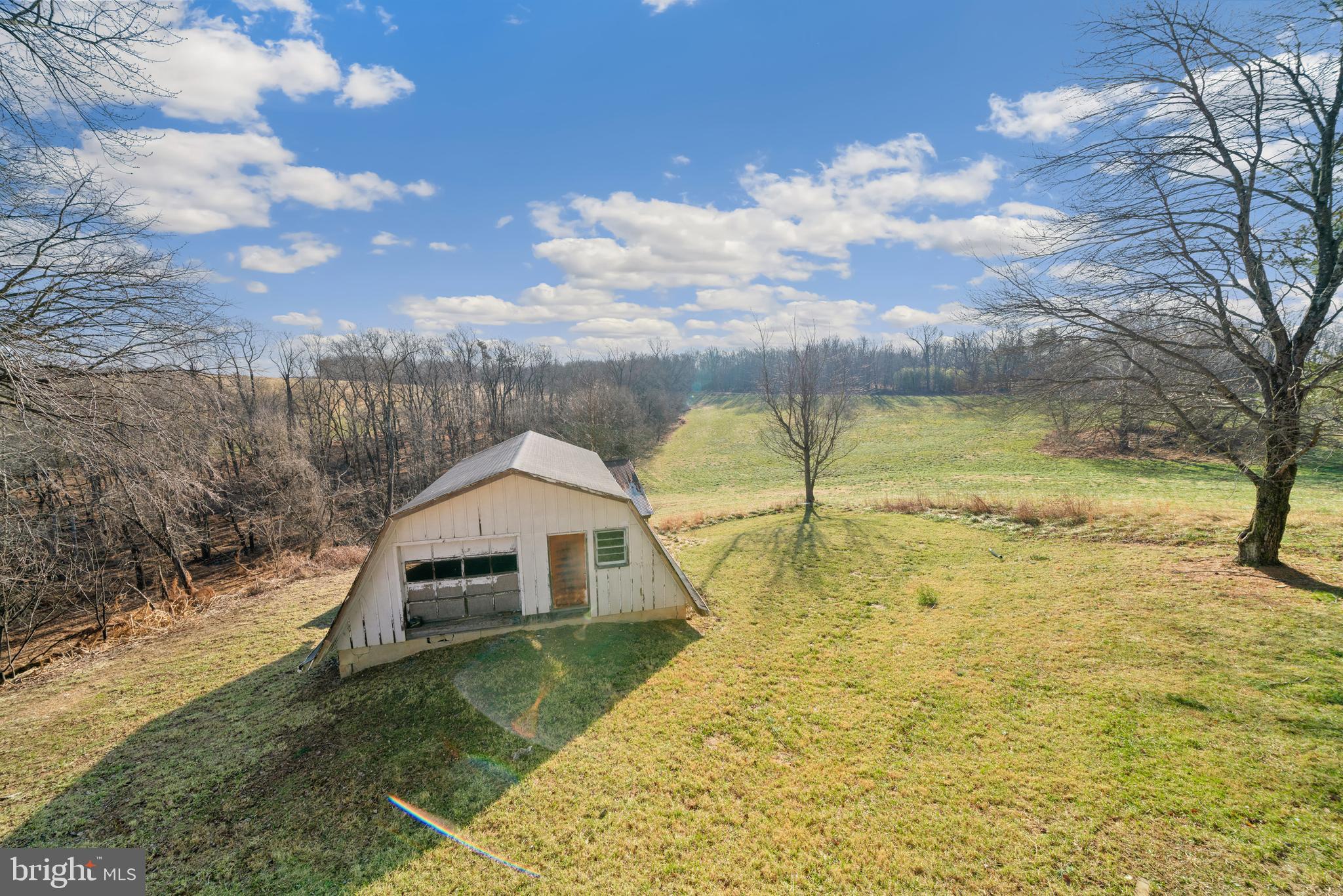 5209 Woodville Road Mount Airy, MD 21771 - Photo 52 of 90 a view of a swimming pool with an outdoor space