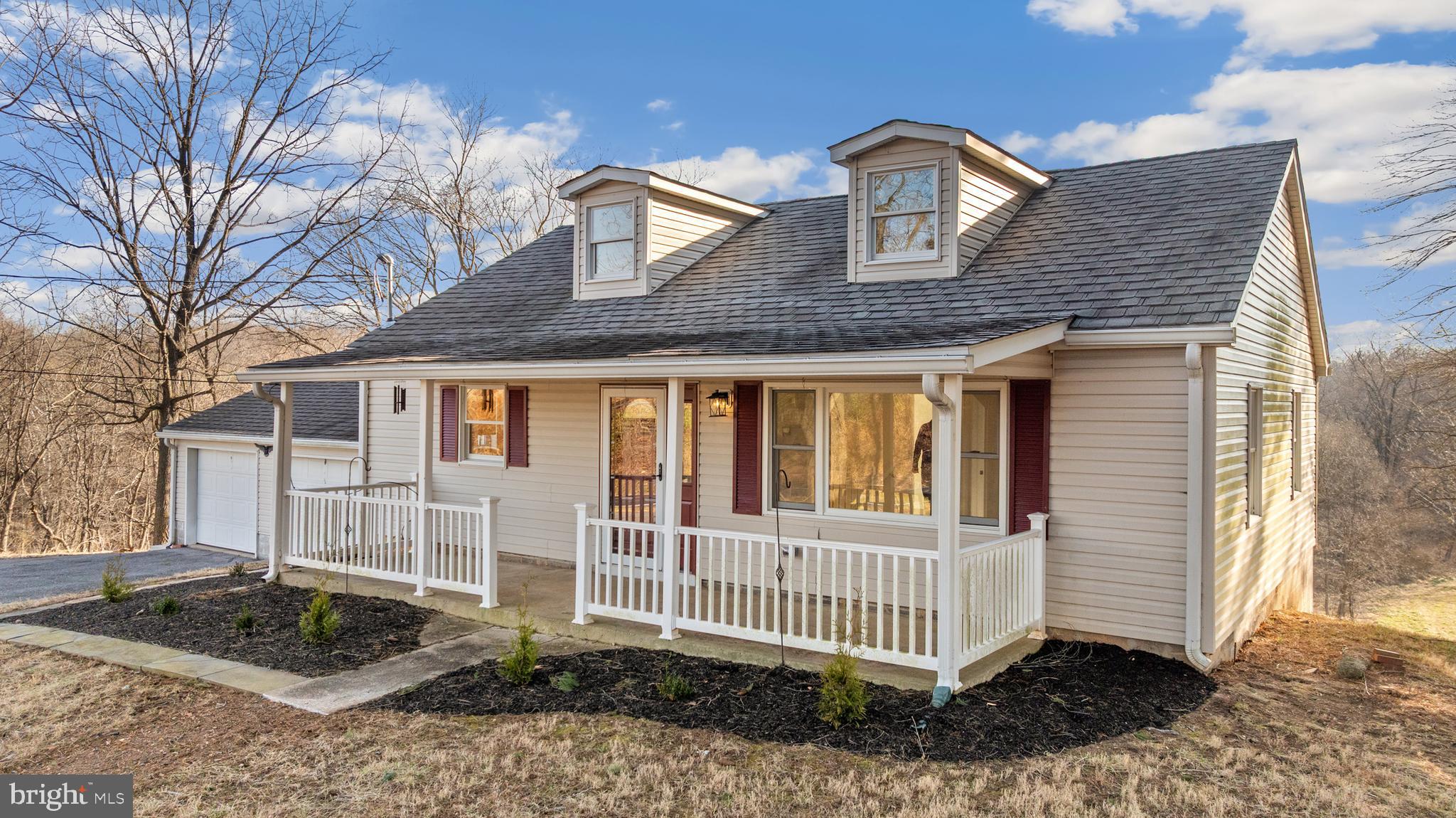 5209 Woodville Road Mount Airy, MD 21771 - Photo 6 of 90 a front view of a house with a yard