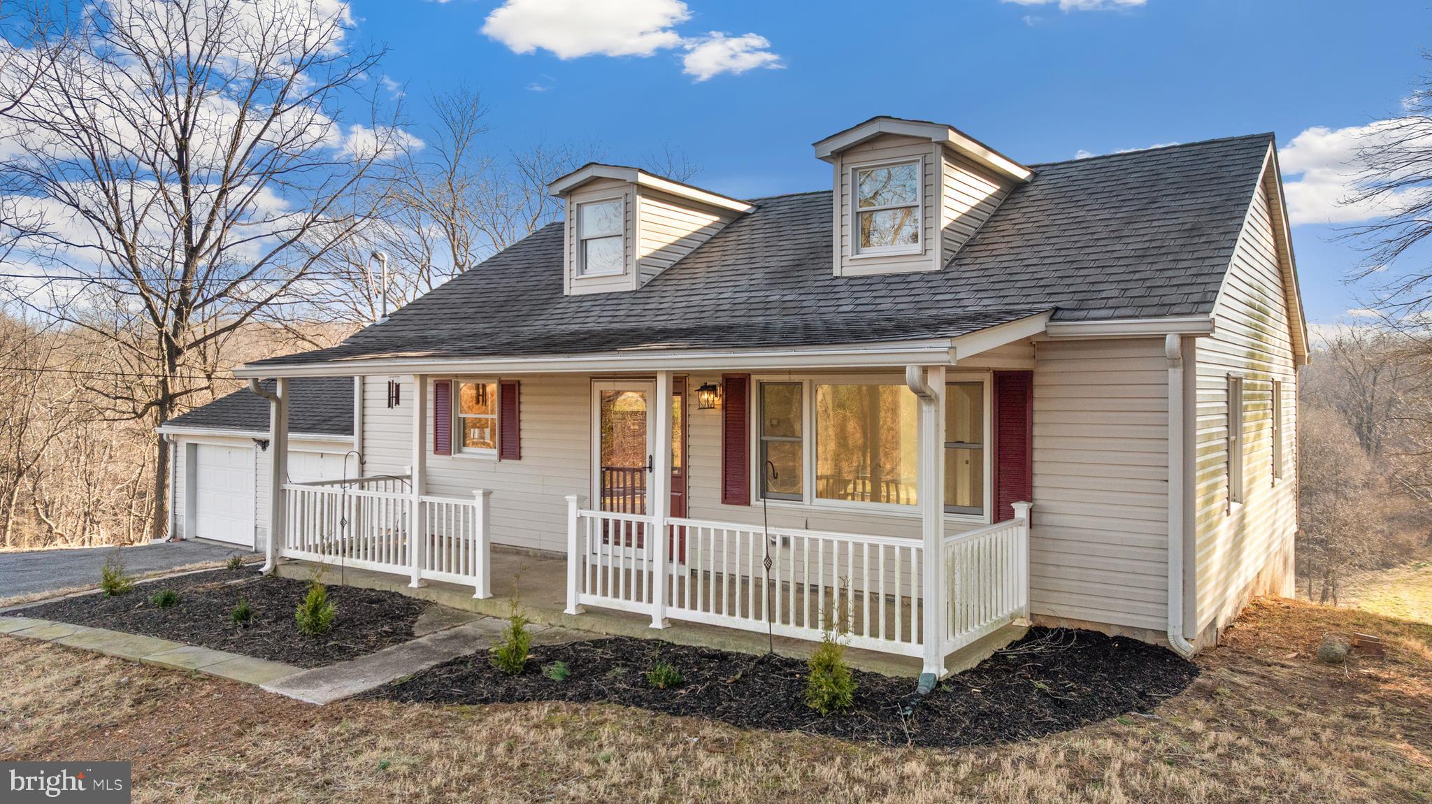 5209 Woodville Road Mount Airy, MD 21771 - Photo 7 of 90 a front view of a house with a yard