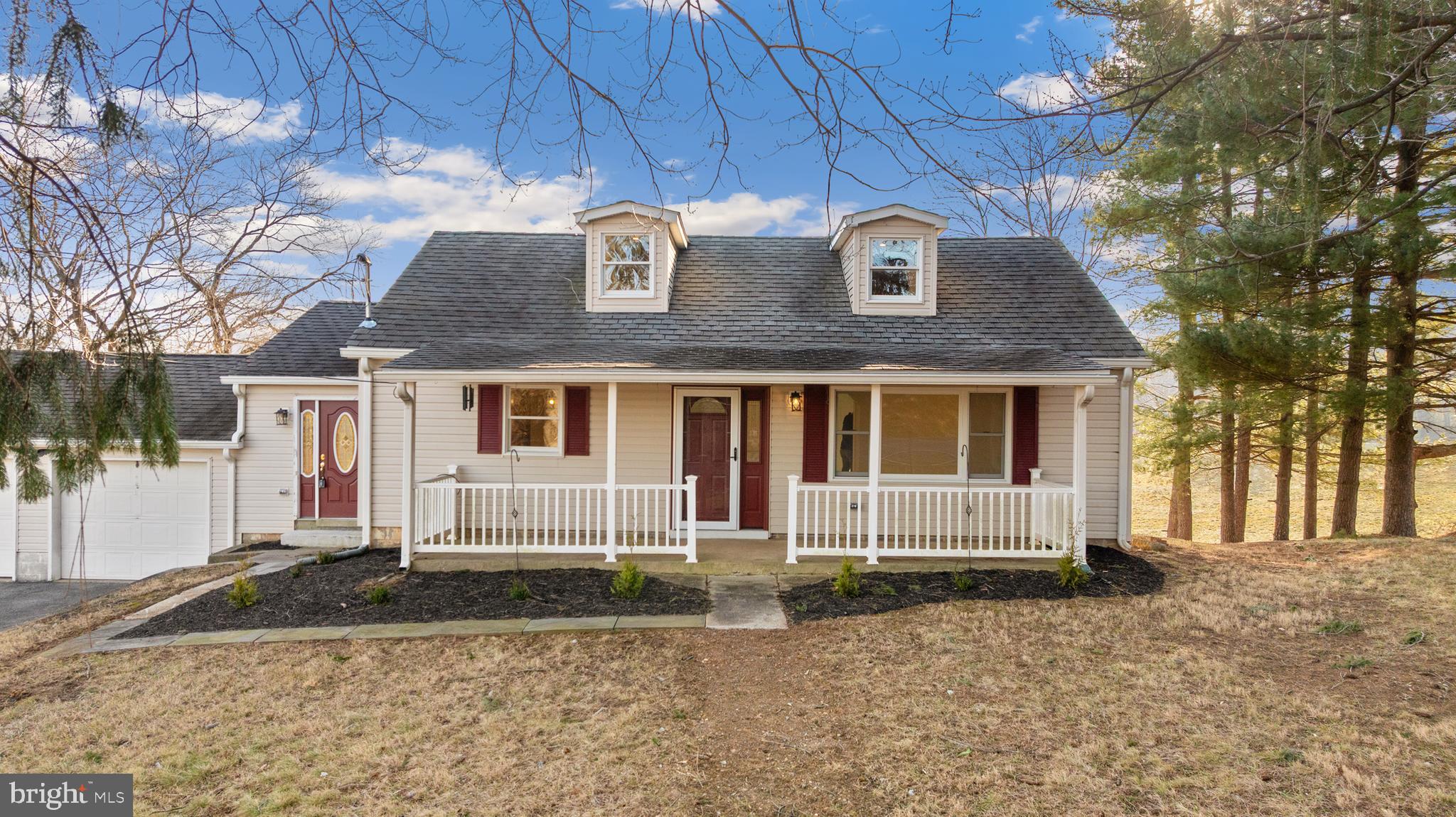 5209 Woodville Road Mount Airy, MD 21771 - Photo 8 of 90 a front view of a house with a yard