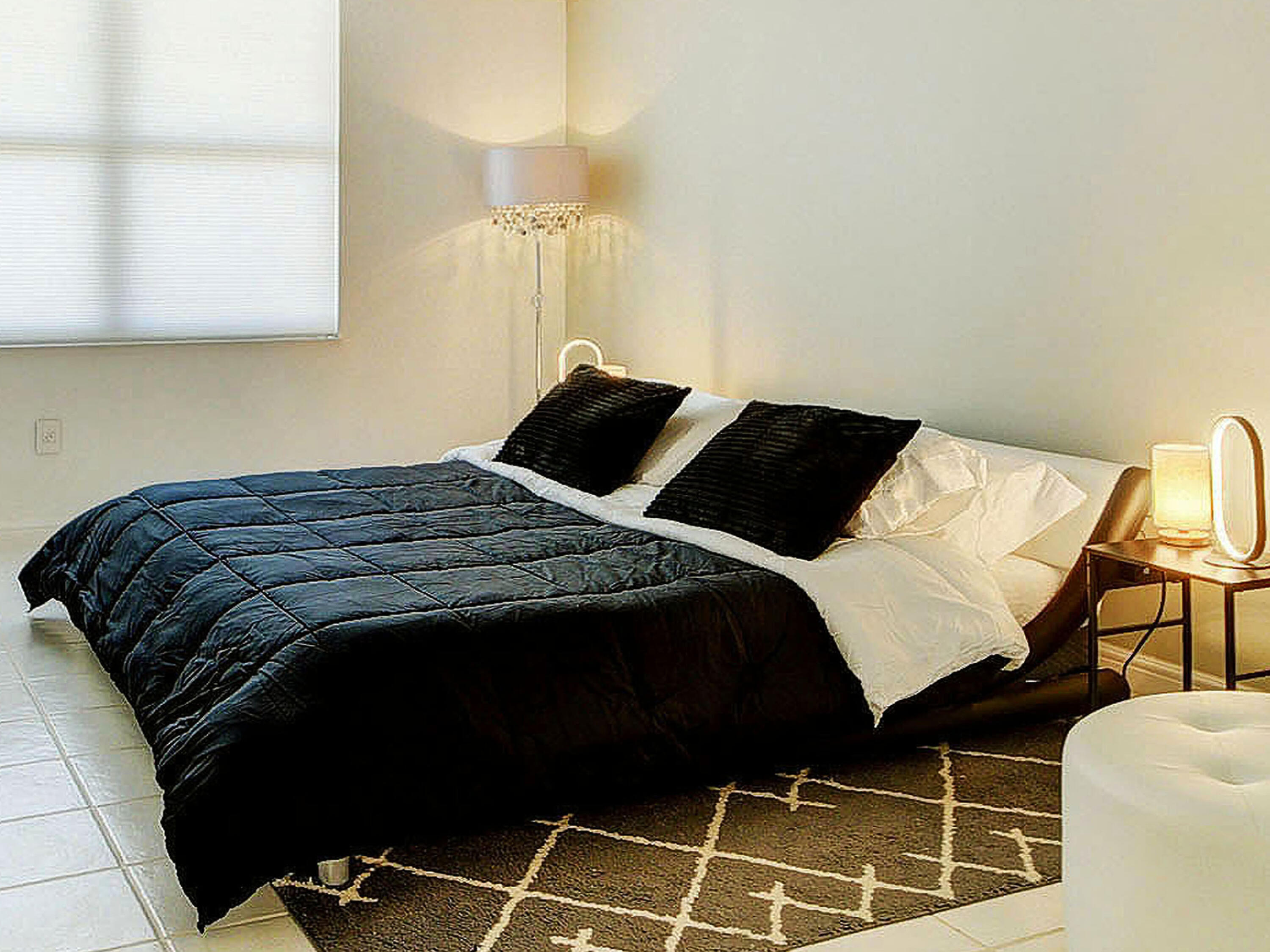 3460 South Ocean Boulevard, Unit 7110 Palm Beach, FL 33480 - Photo 13 of 23 a bedroom with a bed and walk in closet