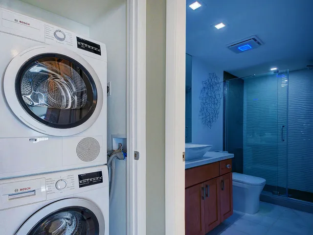 a view of bathroom with washer and dryer