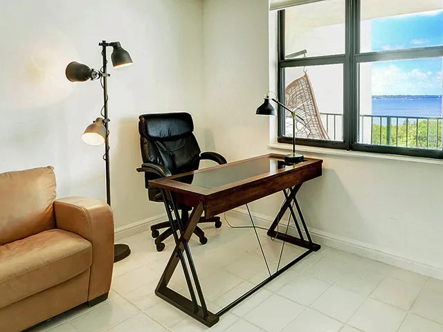 a work room with furniture and windows