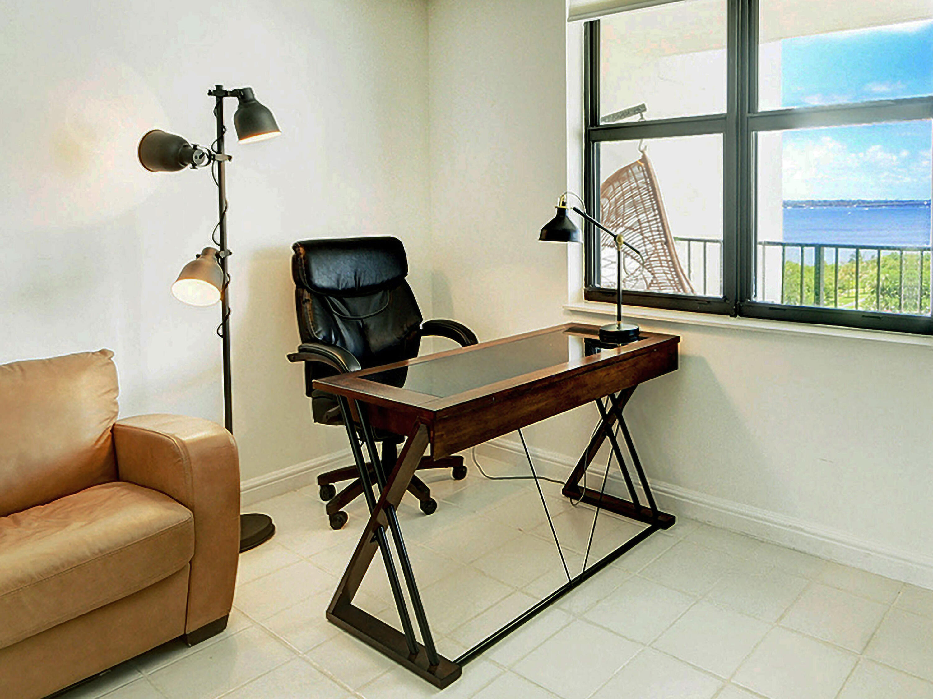 3460 South Ocean Boulevard, Unit 7110 Palm Beach, FL 33480 - Photo 19 of 23 a work room with furniture and windows