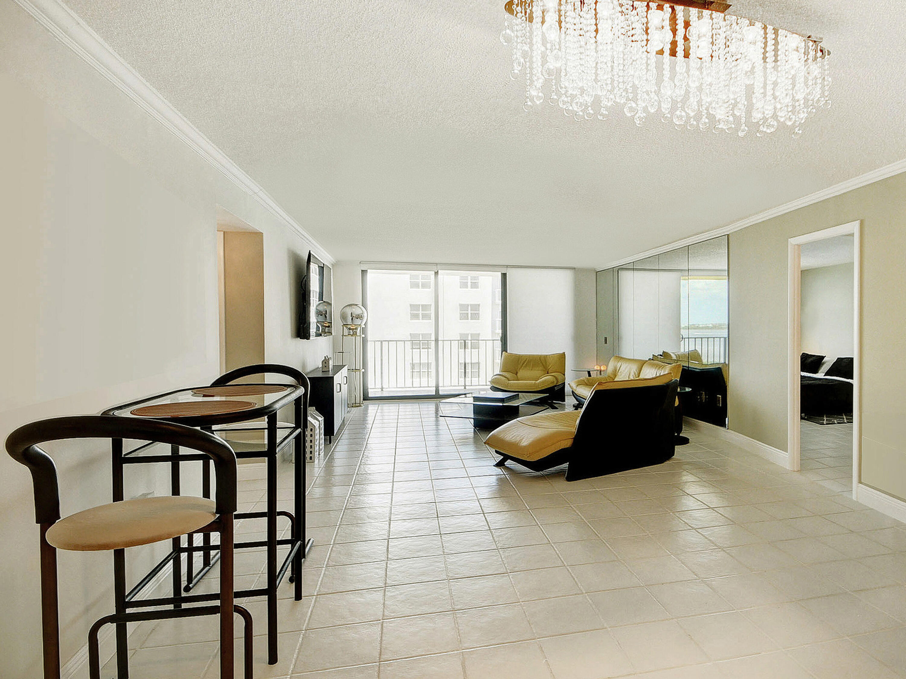 3460 South Ocean Boulevard, Unit 7110 Palm Beach, FL 33480 - Photo 7 of 23 a living room with furniture and a large window