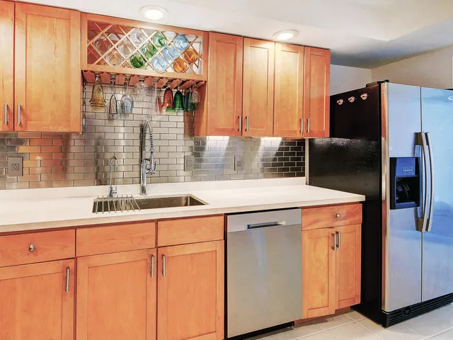 a kitchen with a sink and cabinets