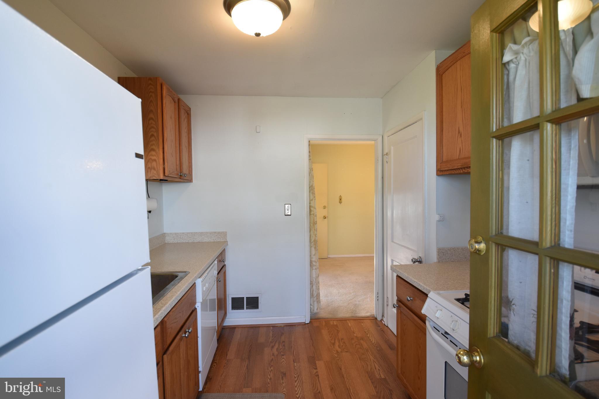 2421 Ellis Road Baltimore, MD 21234 - Photo 26 of 27 Kitchen with corian counters& appliances