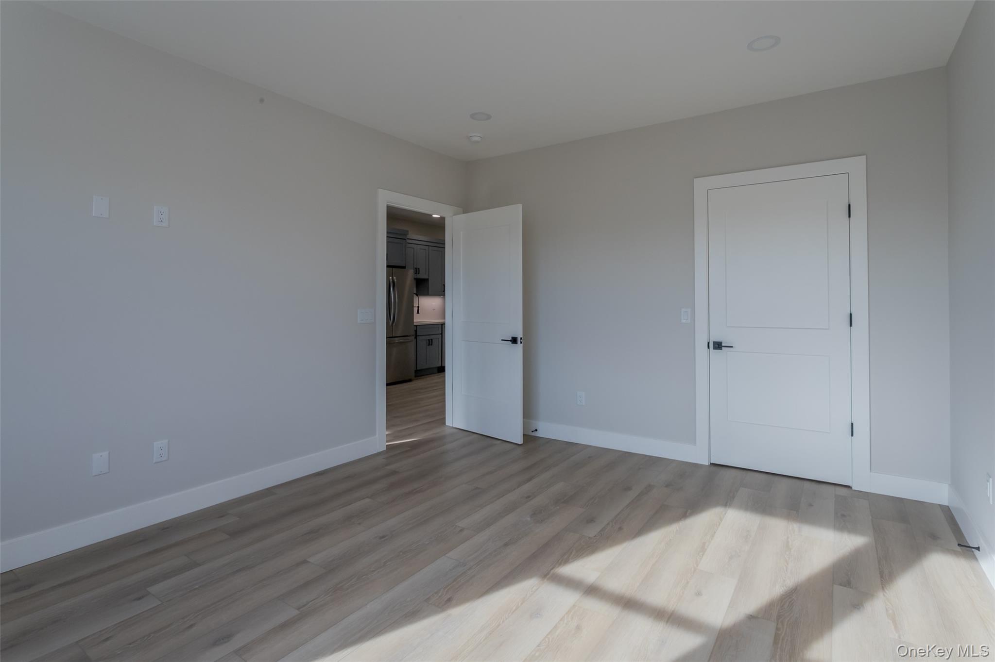 124 South Main Street, Unit 2203 Florida, NY 10921 - Photo 11 of 16 wooden floor in an empty room