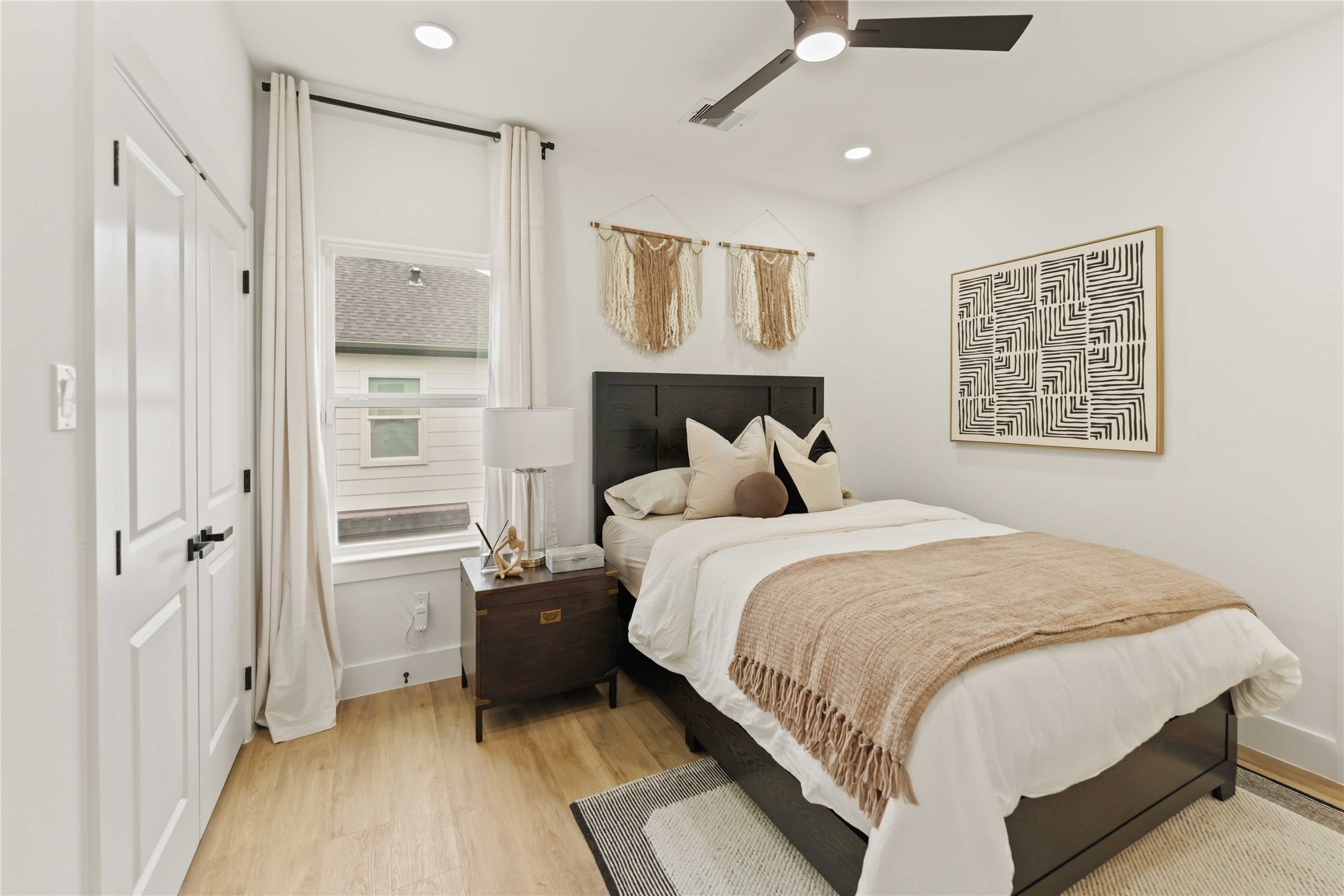 6539 Sealey Street Houston, TX 77091 - Photo 26 of 28 a bedroom with a bed and a window