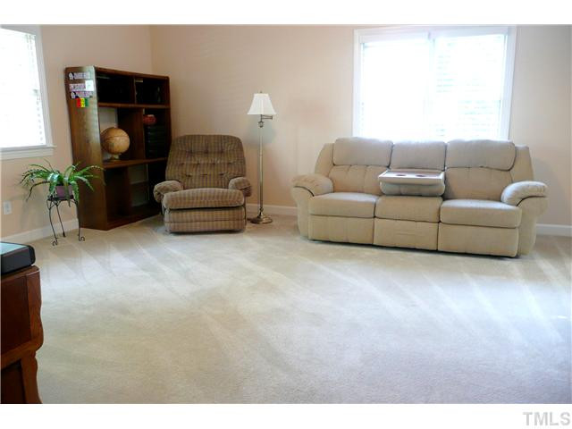 5116 Salem Ridge Road Holly Springs, NC 27540 - Photo 19 of 25 This large bonus room is accessed by both front and back stairs. This room could make a great playroom or a great room to enjoy family movie night. Bonus Room