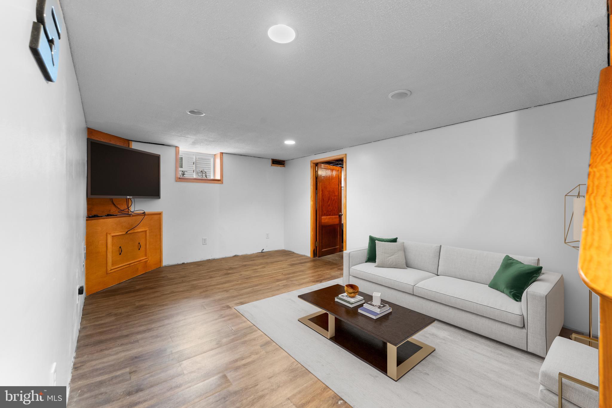 4812 Ridge Road Rosedale, MD 21237 - Photo 10 of 22 Lower Lvl Family Room - Virtually Staged