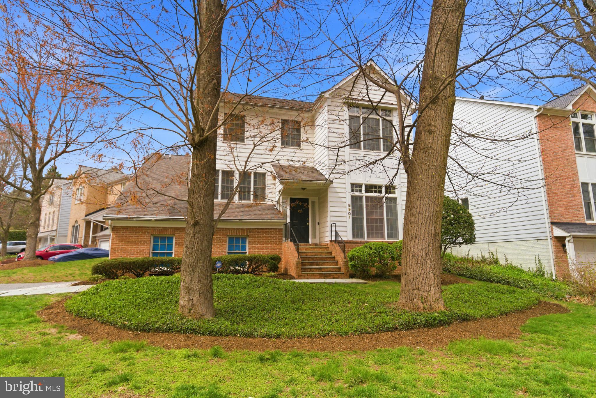 Charming home with lush landscaping.