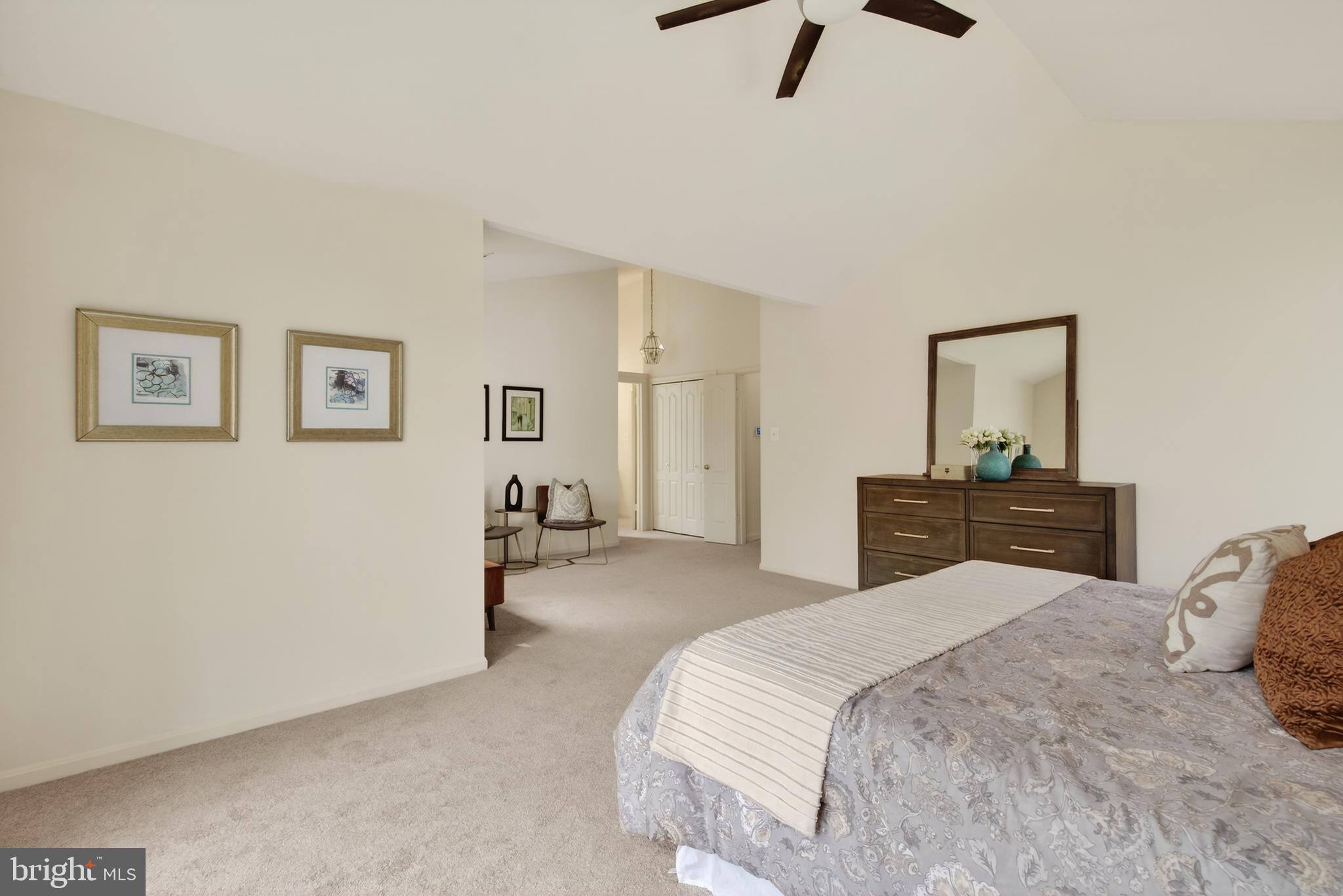 8901 Ellsworth Court Silver Spring, MD 20910 - Photo 27 of 43 a bedroom with a bed and a chandelier