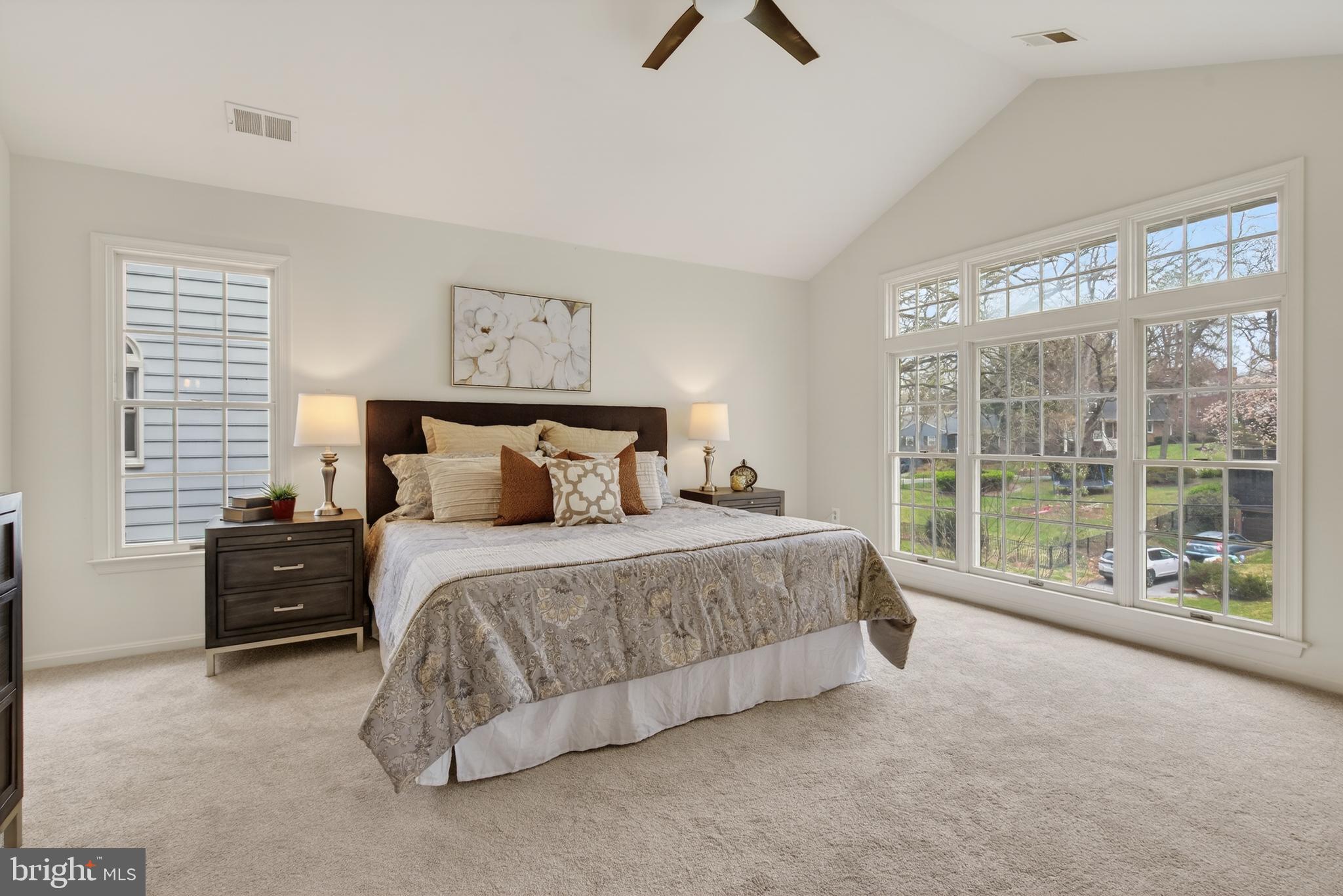 8901 Ellsworth Court Silver Spring, MD 20910 - Photo 29 of 43 a spacious bedroom with a large bed and a large window