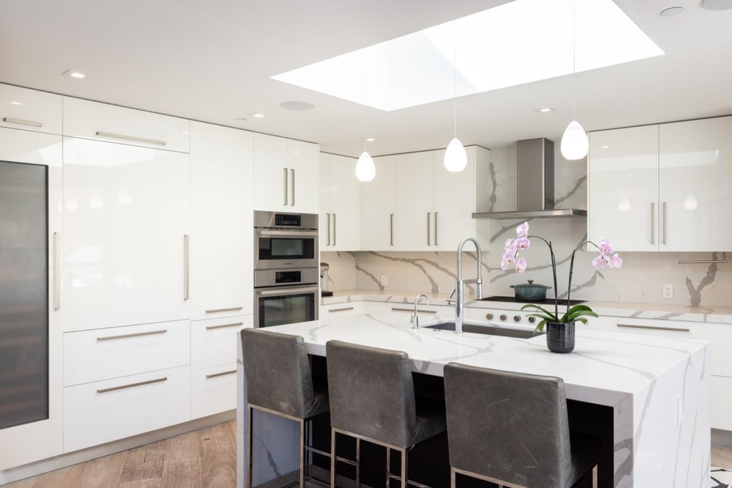 1505 Venadero Road Pebble Beach, CA 93953 - Photo 12 of 34 a kitchen with kitchen island a counter top space appliances and cabinets