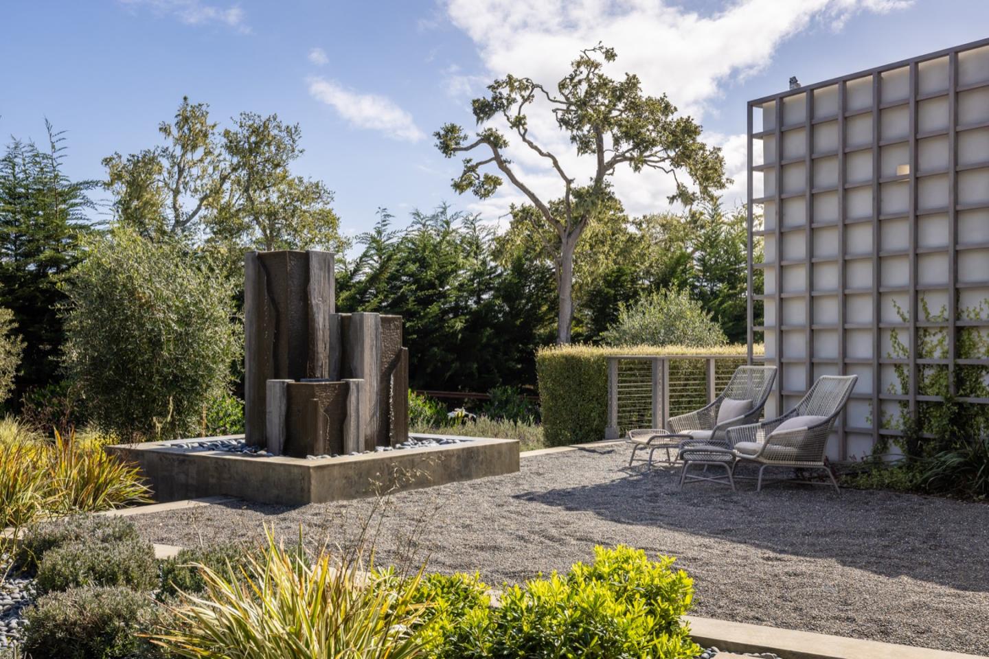 1505 Venadero Road Pebble Beach, CA 93953 - Photo 17 of 34 a view of house with backyard and sitting area