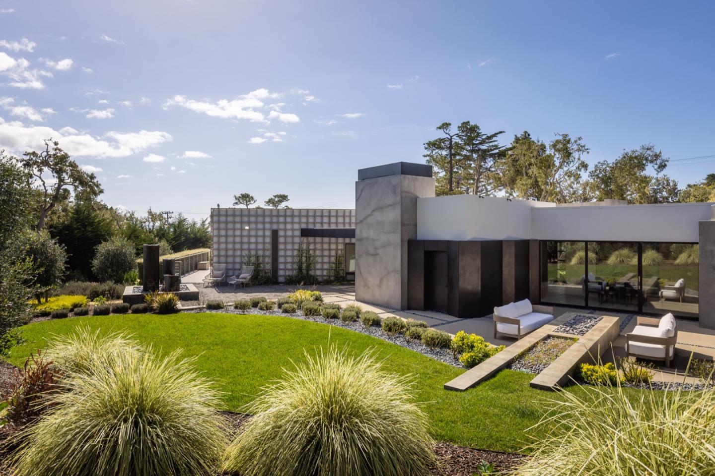 1505 Venadero Road Pebble Beach, CA 93953 - Photo 18 of 34 a view of a house with swimming pool and sitting area