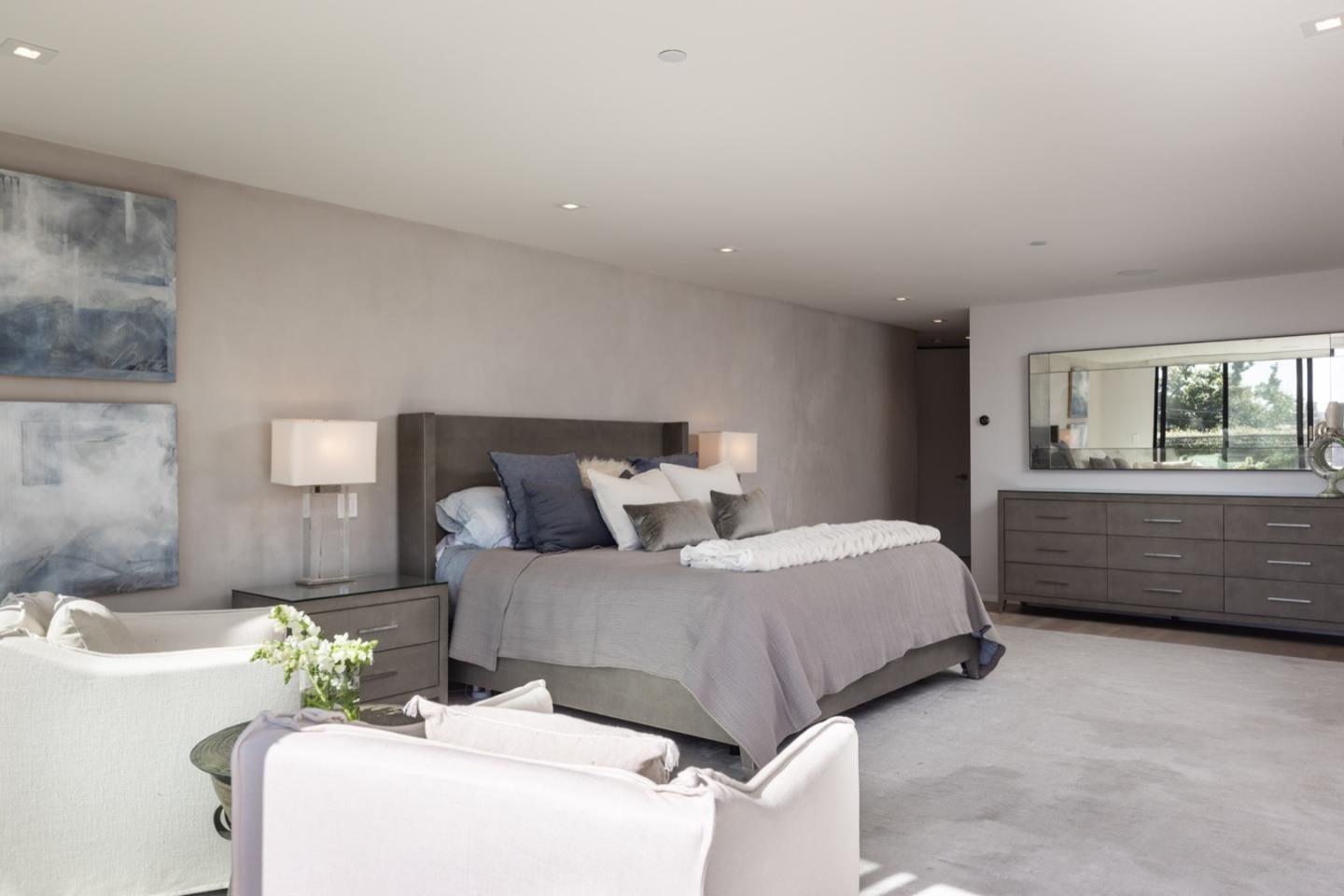 1505 Venadero Road Pebble Beach, CA 93953 - Photo 20 of 34 a bed room with a bed and a dresser