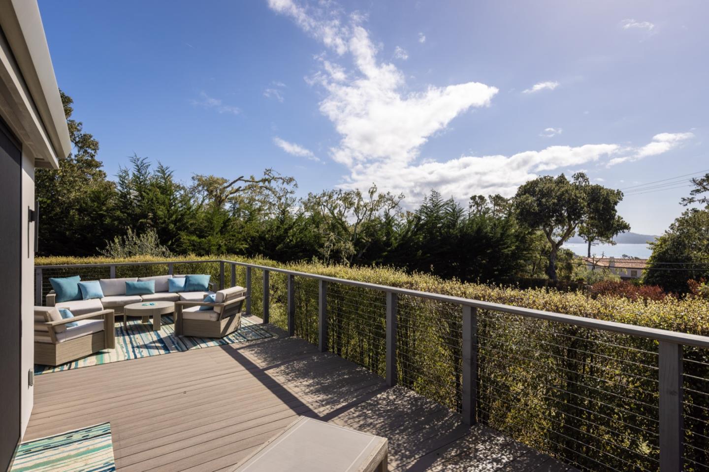 1505 Venadero Road Pebble Beach, CA 93953 - Photo 22 of 34 a balcony with wooden floor and city view