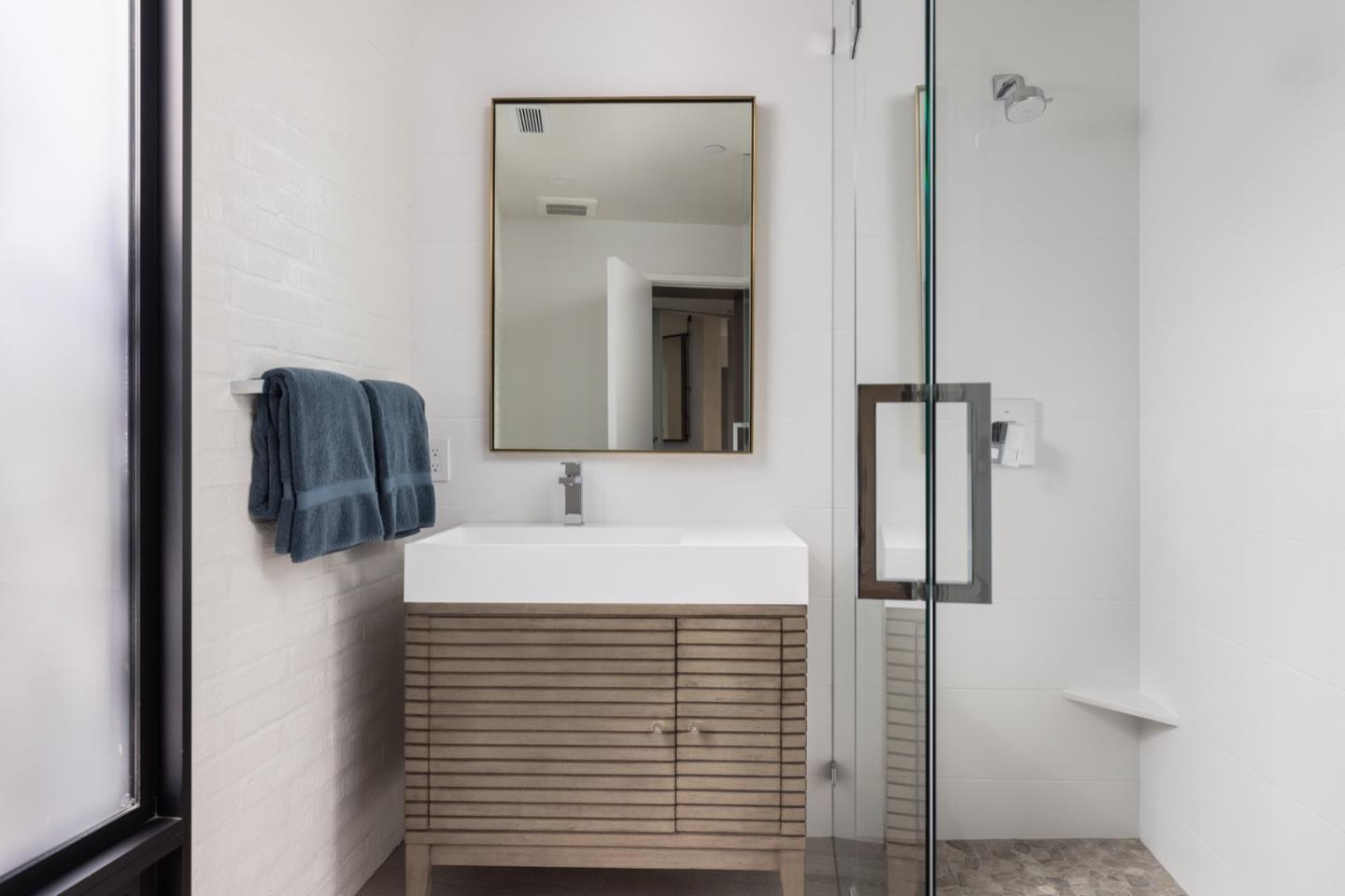 1505 Venadero Road Pebble Beach, CA 93953 - Photo 29 of 34 a bathroom with a sink and a mirror