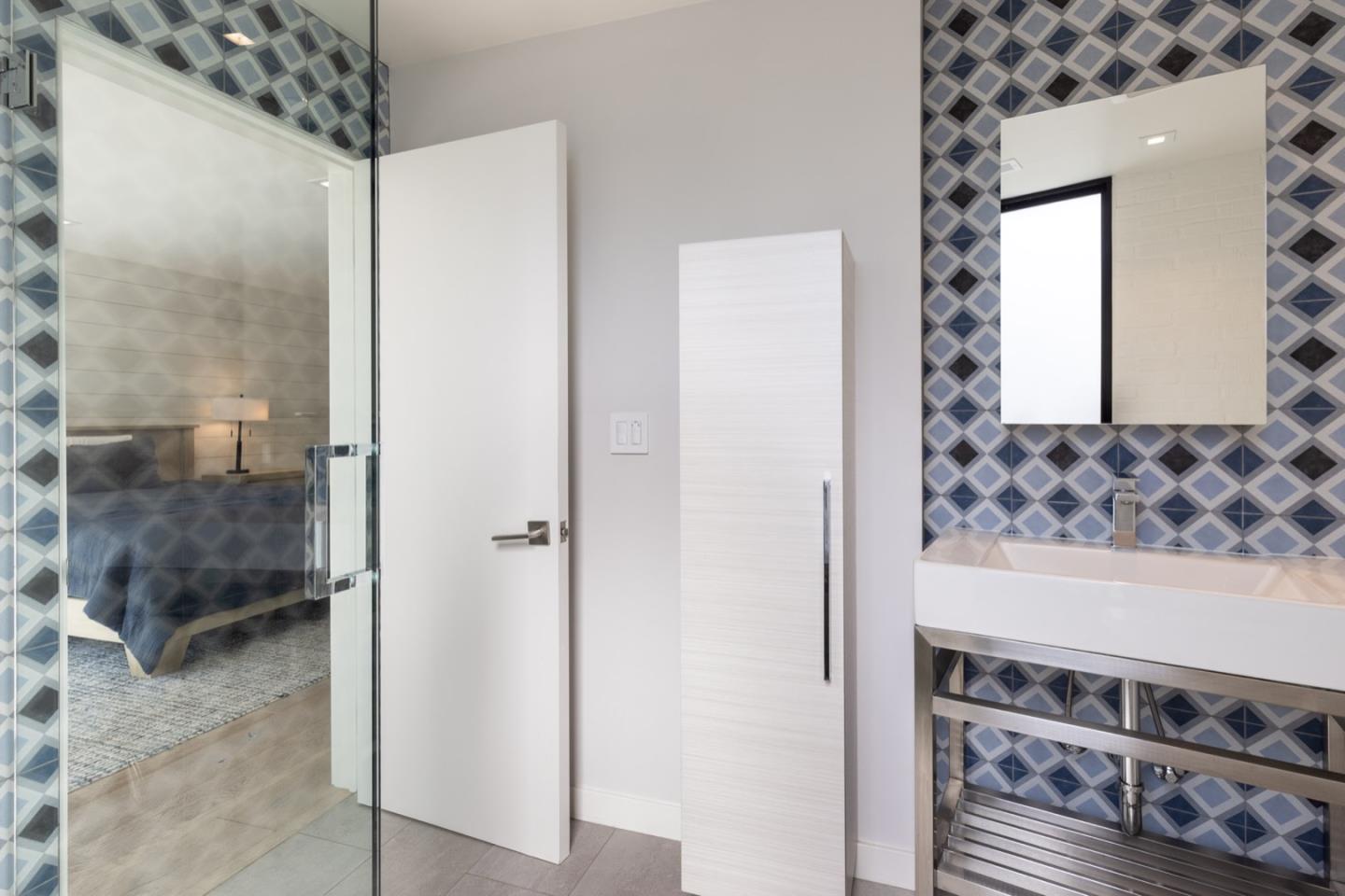 1505 Venadero Road Pebble Beach, CA 93953 - Photo 32 of 34 a view of a bathroom with a sink and a mirror