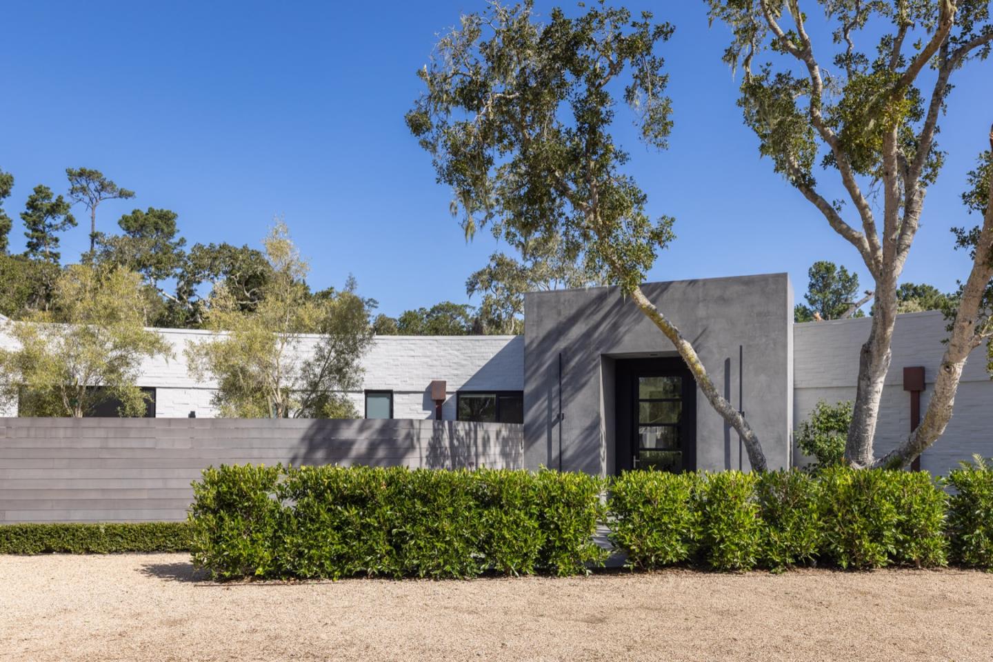 1505 Venadero Road Pebble Beach, CA 93953 - Photo 5 of 34 a front view of a house with a yard