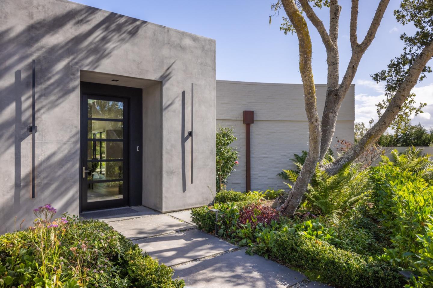 1505 Venadero Road Pebble Beach, CA 93953 - Photo 6 of 34 front view of a house with a yard