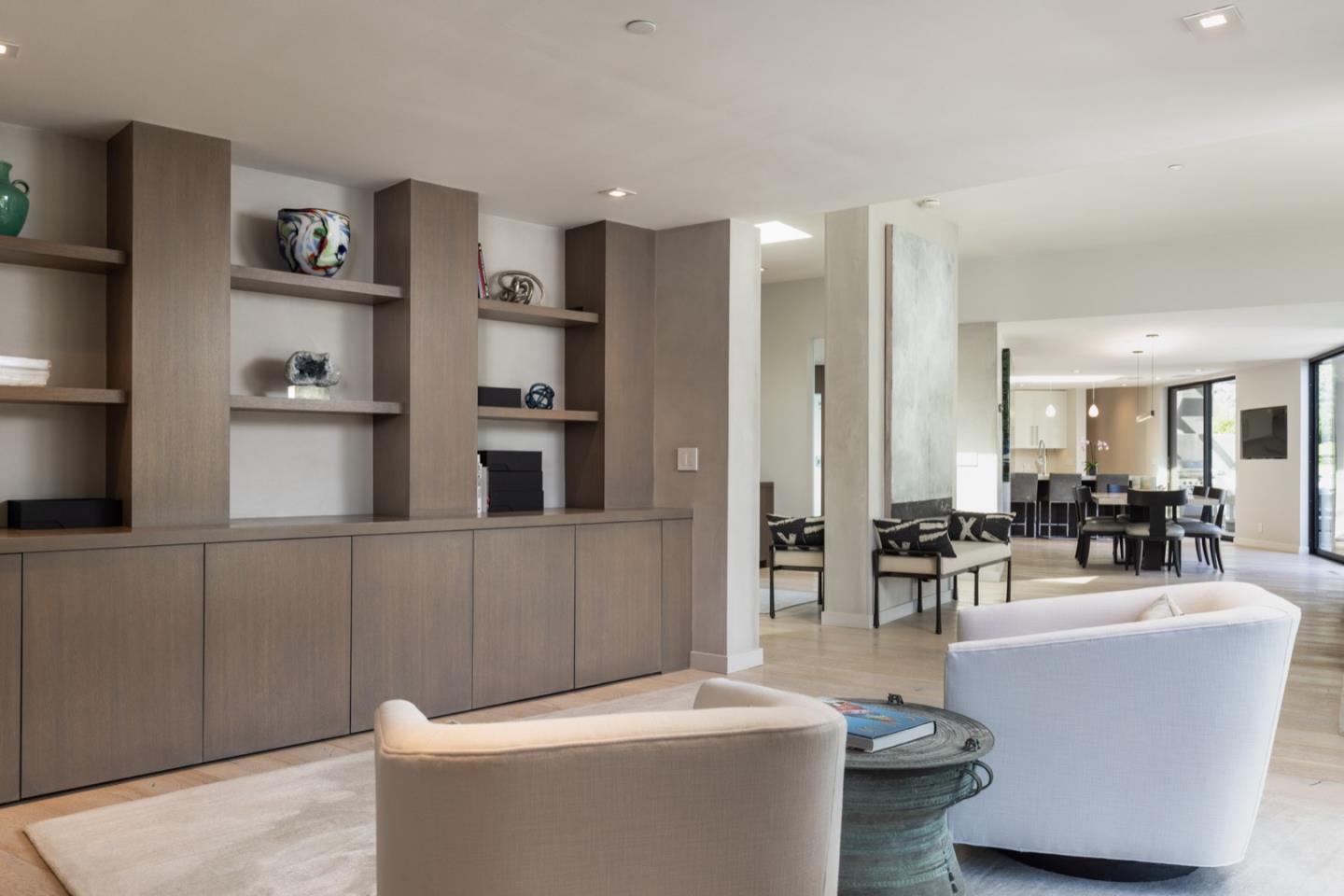 1505 Venadero Road Pebble Beach, CA 93953 - Photo 10 of 34 a living room with furniture and a dining table with wooden floor