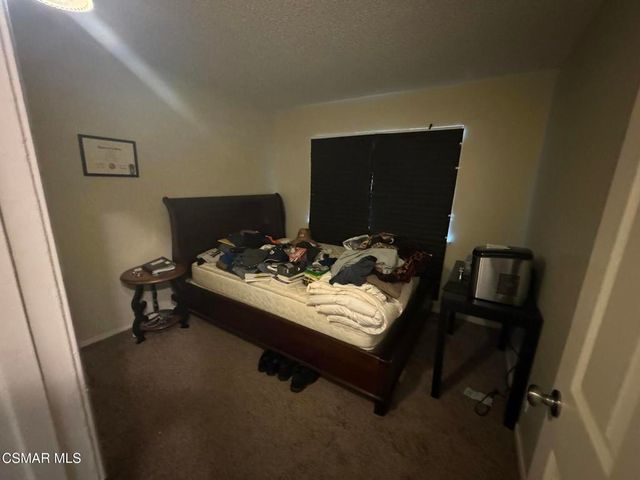 a backyard of a house with outdoor seating