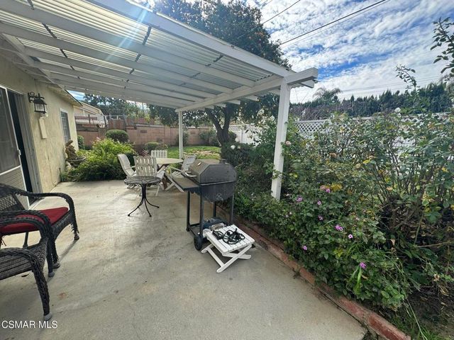 a view of a backyard with large trees