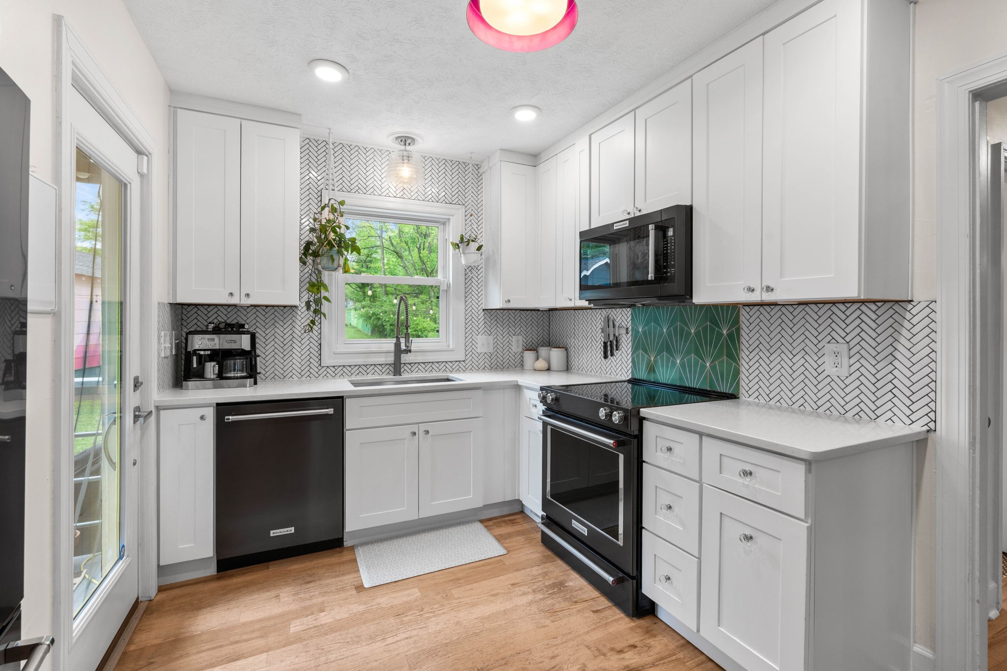 2817 Surrey Road Nashville, TN 37214 - Photo 8 of 26 a kitchen with cabinets appliances a sink and a window