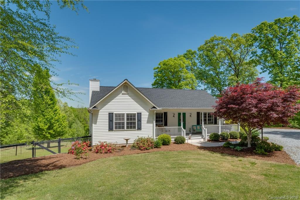433 Meadow Crest Road Tryon, NC 28782 - Photo 1 of 29 a view of a house with a yard and sitting area