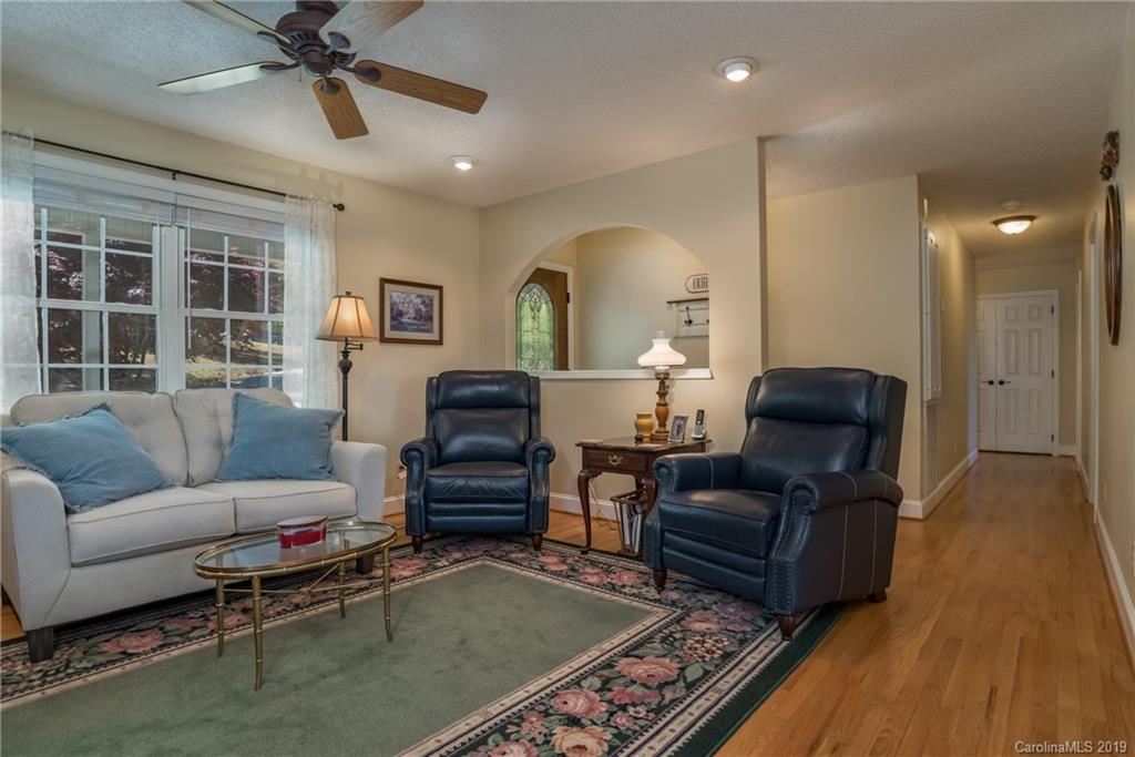 433 Meadow Crest Road Tryon, NC 28782 - Photo 11 of 29 a living room with furniture and a wooden floor