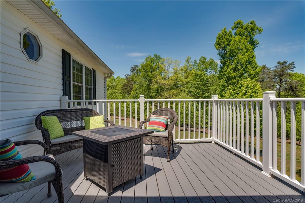 433 Meadow Crest Road Tryon, NC 28782 - Photo 17 of 29 a view of a chairs and table on the deck
