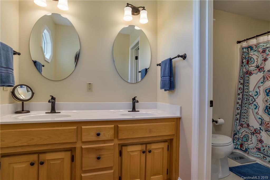 433 Meadow Crest Road Tryon, NC 28782 - Photo 19 of 29 a bathroom with a sink and a mirror